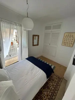 Cama o camas de una habitación en Un patio en La Alameda