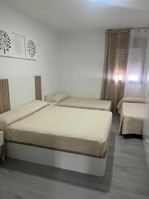 Cama o camas de una habitación en Apartamento El Rincón del Olivar 1