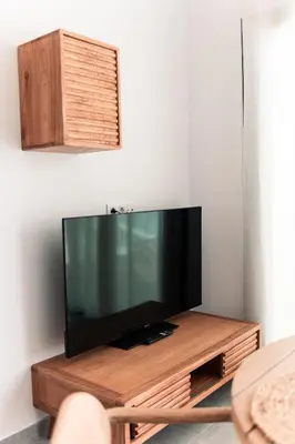 Una televisión o centro de entretenimiento en Villa sunset piscina privada