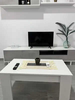 Una televisión o centro de entretenimiento en Apartamento Rincón del Olivar II