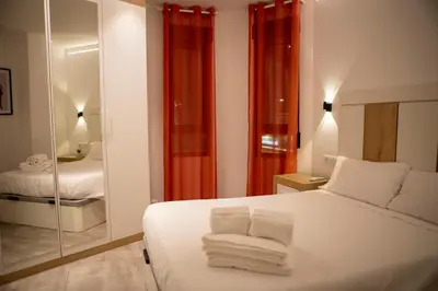 Cama o camas de una habitación en Alojamientos Carola Palma del Río, 6