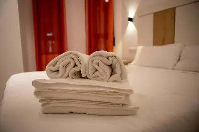 Cama o camas de una habitación en Alojamientos Carola Palma del Río, 6