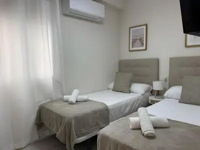 Cama o camas de una habitación en Loyola Premium Córdoba Centro