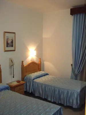 Cama o camas de una habitación en Hostal San Francisco