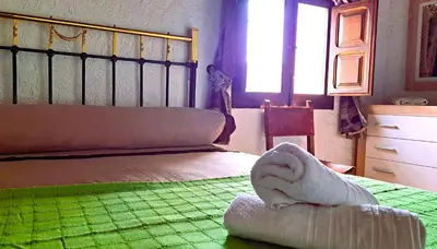 Cama o camas de una habitación en Suitur Cortijo de Don Lolo
