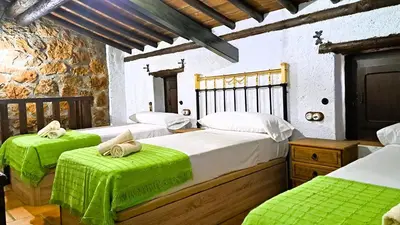 Cama o camas de una habitación en Suitur Cortijo de Don Lolo