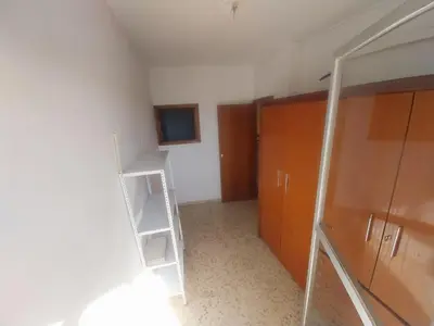 Una televisión o centro de entretenimiento en Habitación Frente al Mercadona A