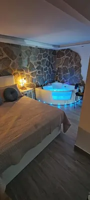 Cama o camas de una habitación en El escondite de MayRa