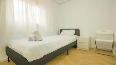 Cama o camas de una habitación en Apartamento Luz de Macarena en Sevilla