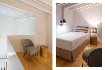 Cama o camas de una habitación en R26 Suites Sevilla