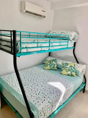 Cama o camas de una habitación en Tu Descanso en Sevilla