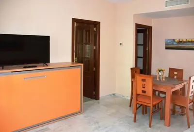 Una televisión o centro de entretenimiento en CASA PATIO LAS PALMERAs 7 y 8