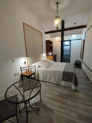 Cama o camas de una habitación en La REJA SUITE