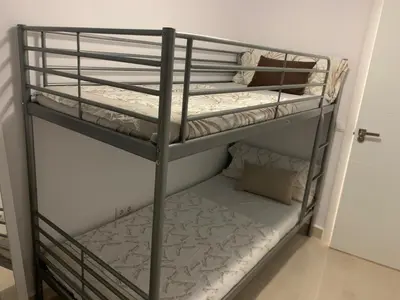 Cama o camas de una habitación en Parque Amate Sevilla