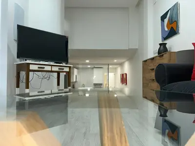 Una televisión o centro de entretenimiento en Apartamento Loft Cervantes