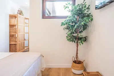 Cama o camas de una habitación en Céntrico apartamento con piscina