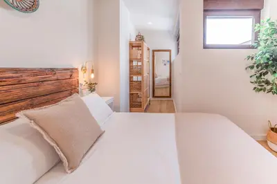 Cama o camas de una habitación en Céntrico apartamento con piscina