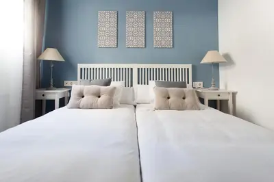 Cama o camas de una habitación en Apartamentos San Leandro Ensenada