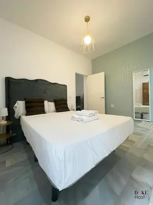 Cama o camas de una habitación en San Luis Apartment
