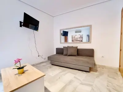 Una televisión o centro de entretenimiento en Estudio Deluxe Alfalfa
