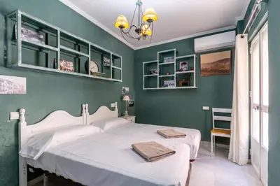 Cama o camas de una habitación en Casa de la Carrera Cantillana
