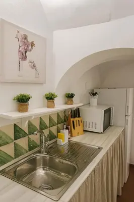 Una cocina o zona de cocina en Un Tesoro en el Corazón de Cordoba & Free Parking