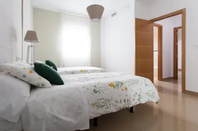 Cama o camas de una habitación en Apartamentos Alberto Lista 9