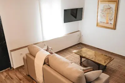 Una televisión o centro de entretenimiento en Casa de los Abuelos en Baeza