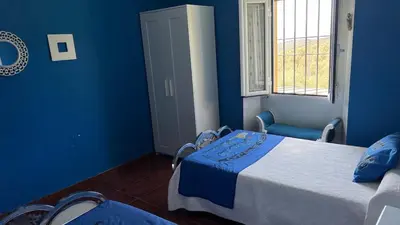 Cama o camas de una habitación en Cortijo rural con piscina y barbacoa Archidona