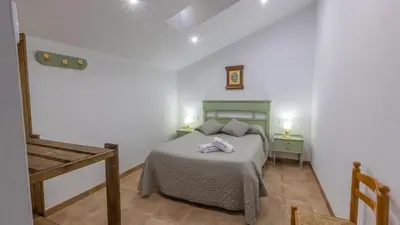 Cama o camas de una habitación en Casilla Soleá Carcabuey by Ruralidays