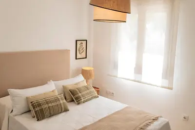 Cama o camas de una habitación en Alojamientos Estrella Baeza