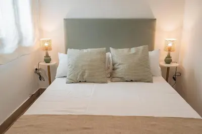 Cama o camas de una habitación en Alojamientos Estrella Baeza
