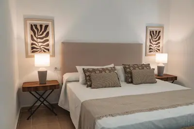 Cama o camas de una habitación en Alojamientos Estrella Baeza