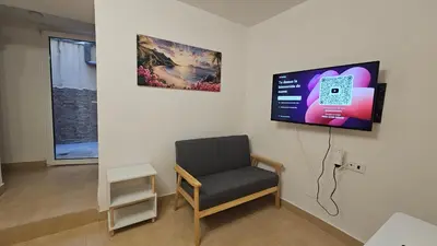 Una televisión o centro de entretenimiento en Apartamento para 2 personas en Jaén