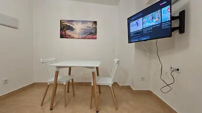 Una televisión o centro de entretenimiento en Apartamento para pareja en Jaén