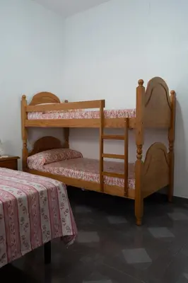 Cama o camas de una habitación en Los Tatos Alojamiento Rural