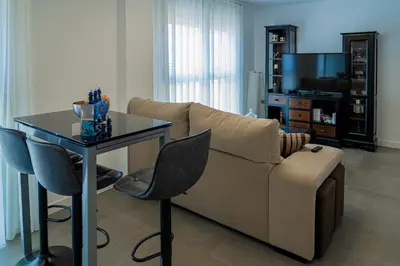 Una televisión o centro de entretenimiento en Piso-loft AOVE pleno centro