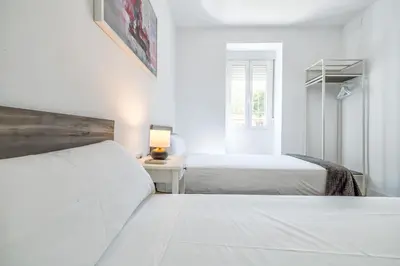 Cama o camas de una habitación en KOKO Apartment junto al casco histórico