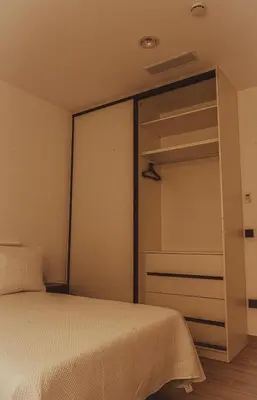 Cama o camas de una habitación en Oliva Suite Apartamentos