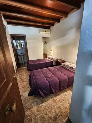 Cama o camas de una habitación en Alojamiento Acuario
