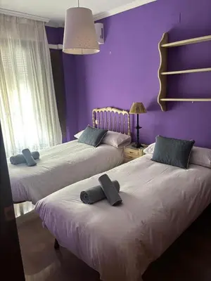 Cama o camas de una habitación en La Casa de Paquita
