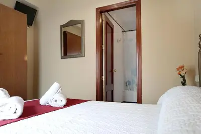 Cama o camas de una habitación en HOSTAL ViCTORiA