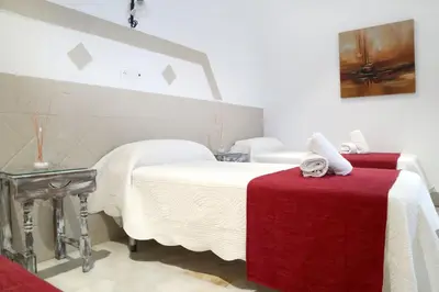 Cama o camas de una habitación en HOSTAL ViCTORiA