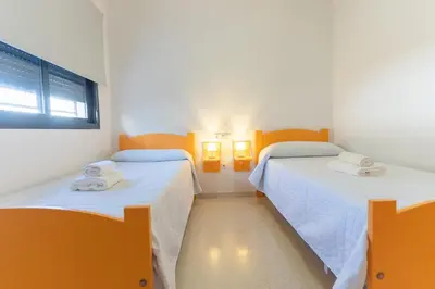 Cama o camas de una habitación en Hostal Las Viñas