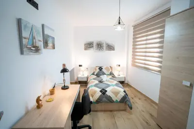 Cama o camas de una habitación en Encanto en Iznájar con terraza y vistas a la montaña