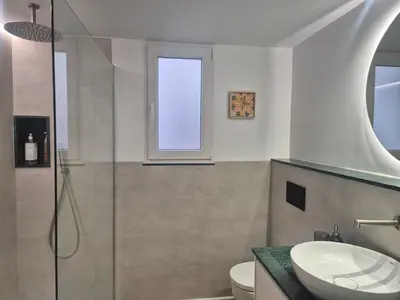 Un baño de Puerta a los Patios