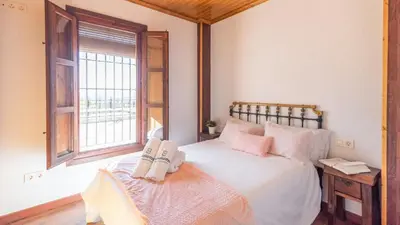 Cama o camas de una habitación en Casa Perdi Riogordo by Ruralidays