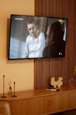 Una televisión o centro de entretenimiento en Apartamento Boutique Centro Histórico