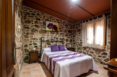 Cama o camas de una habitación en Alojamiento Rural Los Abuelos del Navaltorno