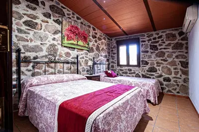 Cama o camas de una habitación en Alojamiento Rural Los Abuelos del Navaltorno